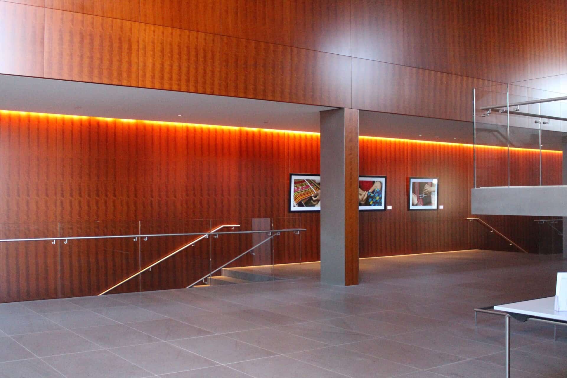 Interior walls clad in cherry wood panels with warm reddish-brown grain